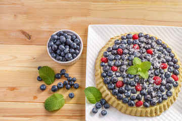 Dessert berry cake blueberry tart with fresh berries and pastry cream