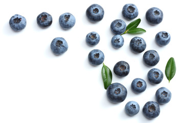 blueberries with green leaf isolated on white background.