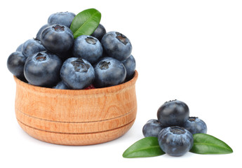 blueberries in wooden bowl isolated on white background