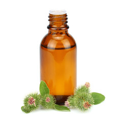 bottle with burdock (castor, agrimony) oil isolated on white background