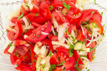 Background of the salad with tomatoes and onion