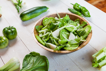 vegetable green salad bowl on kitchen table, balanced diet