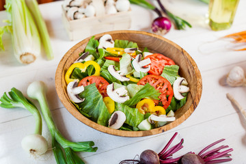 vegetable salad bowl on kitchen table, balanced diet