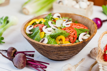 vegetable salad bowl on kitchen table, balanced diet