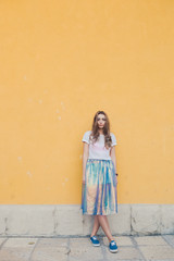 Fototapeta premium Young pretty girl posing in the street