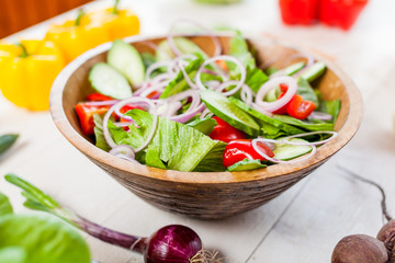 vegetable salad bowl on kitchen table, balanced diet