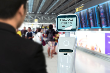 Businessman suit passenger use self driving chcek-in robots assistant for ticket and accompany them to their gate at international airport.