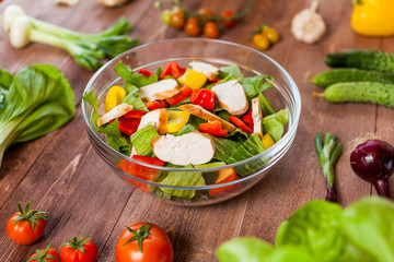 chicken salad bowl on kitchen table, balanced diet