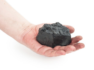 A piece of coal in hand