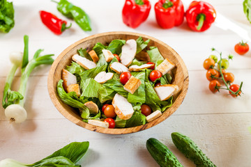 chicken salad bowl on kitchen table, balanced diet