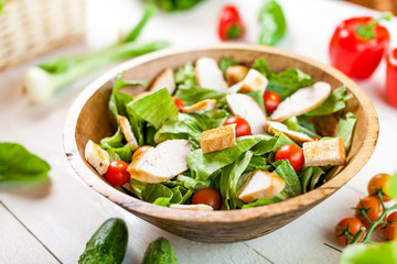 chicken salad bowl on kitchen table, balanced diet