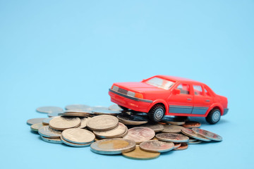 save money for investment concept Toy car and stack of coins