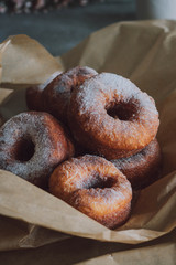 Homemade donuts in powdered sugar