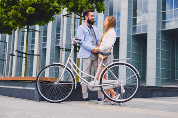 A couple on a date after bicycle ride in a city.