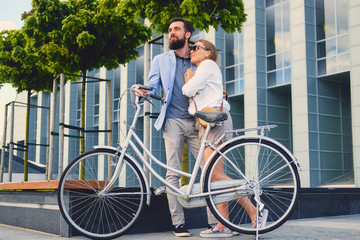 A couple on a date after bicycle ride in a city.