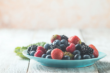 different berries in bowl.