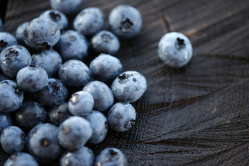 Blueberries on a dark wooden background