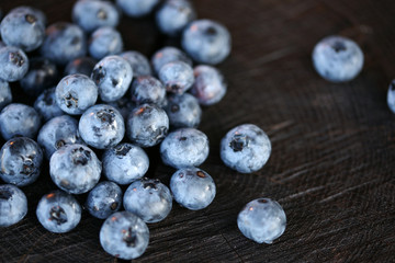 Blueberries on a dark wooden background