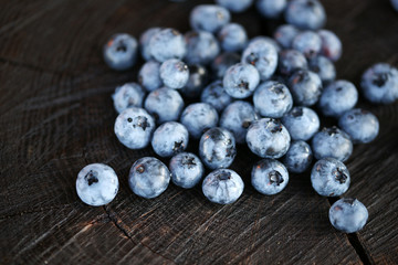 Blueberries on a dark wooden background