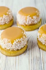 yellow cakes on wood surface