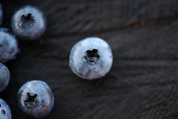 Blueberries on a dark wooden background
