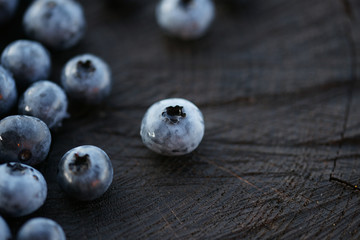 Blueberries on a dark wooden background