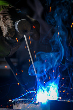 Worker welding the iron