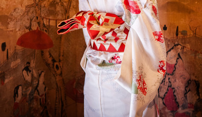 Japanese woman in Kimono dress, close up at Obi.