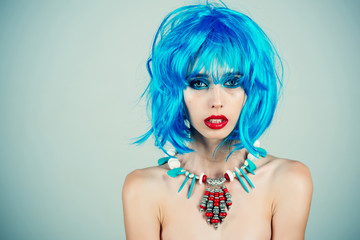 woman with blue hair wig and fashionable makeup