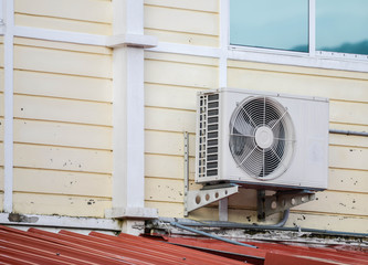 Air compressors is installed on the outside of the building