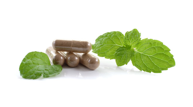 mint leaves and drug isolated on white background