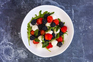 Delicious summer salad with watermelon and blackberry with mozzarella cheese.