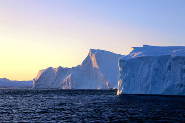 iceberg in a sunset fjord from a Aerial view, in greenland   © shenmanjun