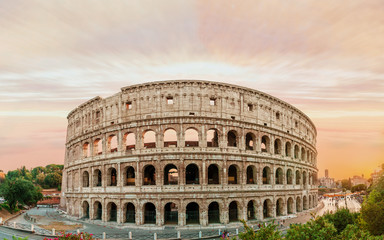 Fototapeta na wymiar Colosseum panorama at sunset time with marvelous sky.