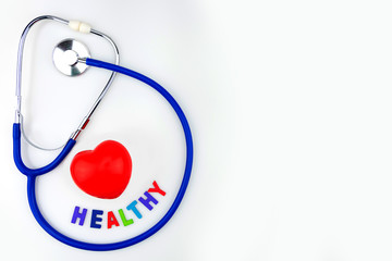 Blue stethoscope isolated and red heart on white background