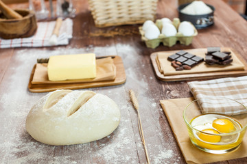 fresh dough on kitchen  rustic wooden table.