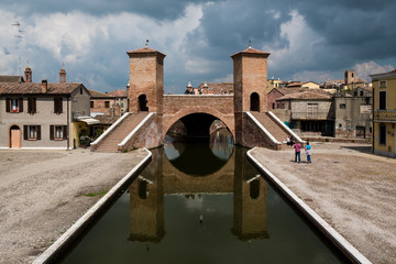 Comacchio, Ferrara, Emilia Romagna, Italy, Europe. The ancient bridge Trepponti, a famous five-way bridge in the old town known as the Little Venice