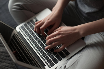 Fototapeta na wymiar girl hands typing on laptop