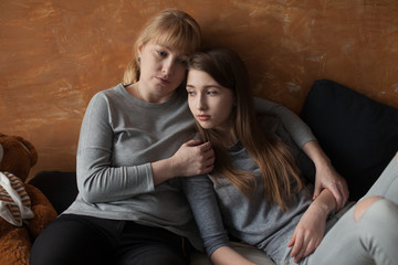mother and daughter on bed
