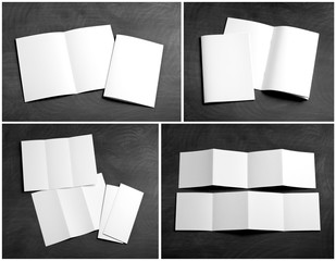 blank white folding paper flyer on a black chalkboard