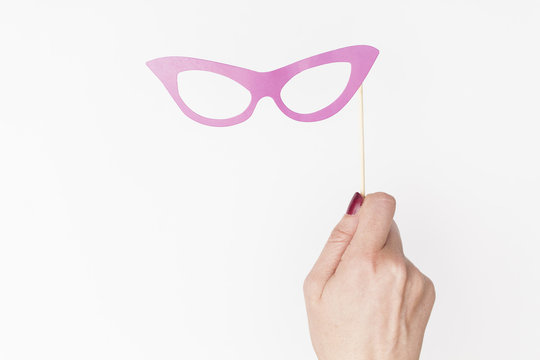 female hand holding glasses photo booth prop