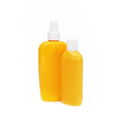 Plastic bottles with cosmetics on a white background