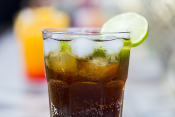 Cola drink with ice and lime