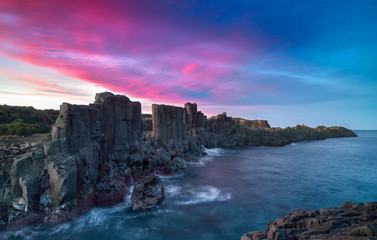 Basalt rock formations on sunset