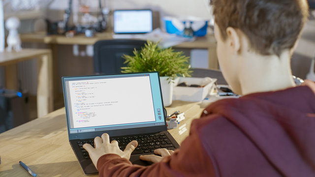 Smart Boy Works on a Project For His Computer Science Club with Special Program.