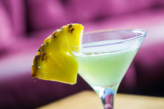 Coctail With Pineapple In Martini Glass