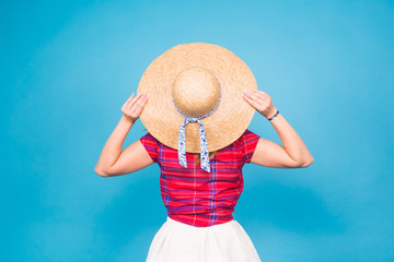 Beautiful woman in hat, back view