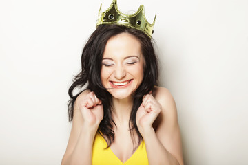 lifestyle, people and emotional concept: young  woman in crown