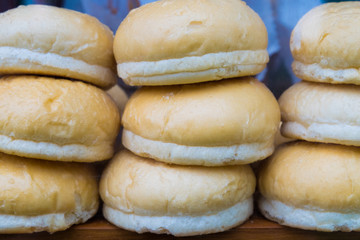 Round buns are placed lined up waiting for customers to buy
