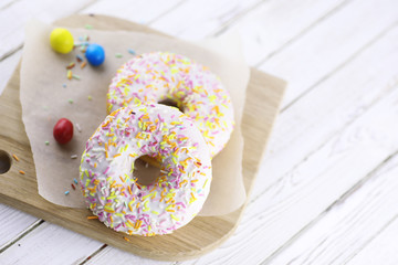 Donut on a wooden white background